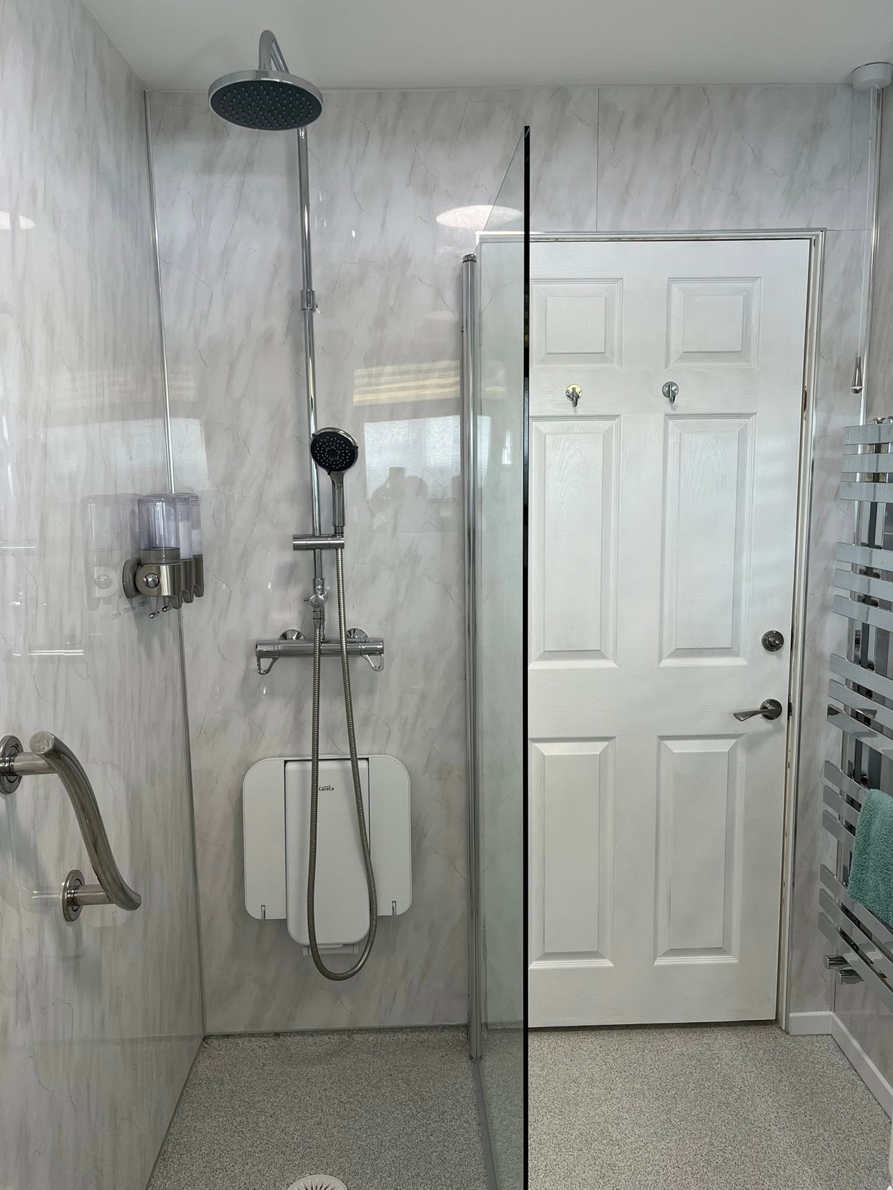 Accessible wet room adaptation with level-access shower, Pembrokeshire